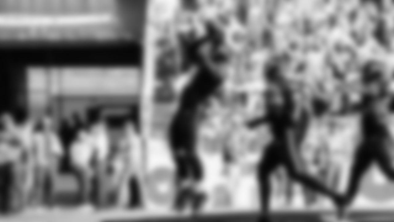 Seahawks linebacker Tyrice Knight (48) sacks Cardinals QB Jacoby Brissett and defensive end DeMarcus Lawrence (0) scoops the ball up and scores the touchdown.