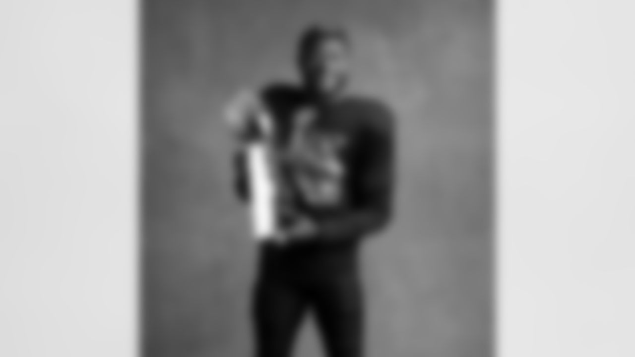 Seahawks linebacker Ernest Jones IV (13) with the Lombardi Trophy after winning Super Bowl LX.