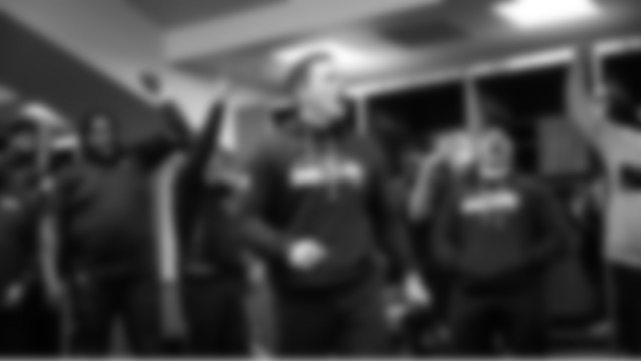 Seahawks head coach Mike Macdonald celebrates with his team in the locker room as they advanced to the NFC Championship game.