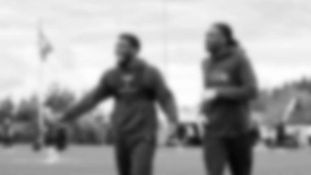 Seahawks cornerback Devon Witherspoon (21) and cornerback Riq Woolen (27) participated in a workout on May 21, 2025 at the Virginia Mason Athletic Center.