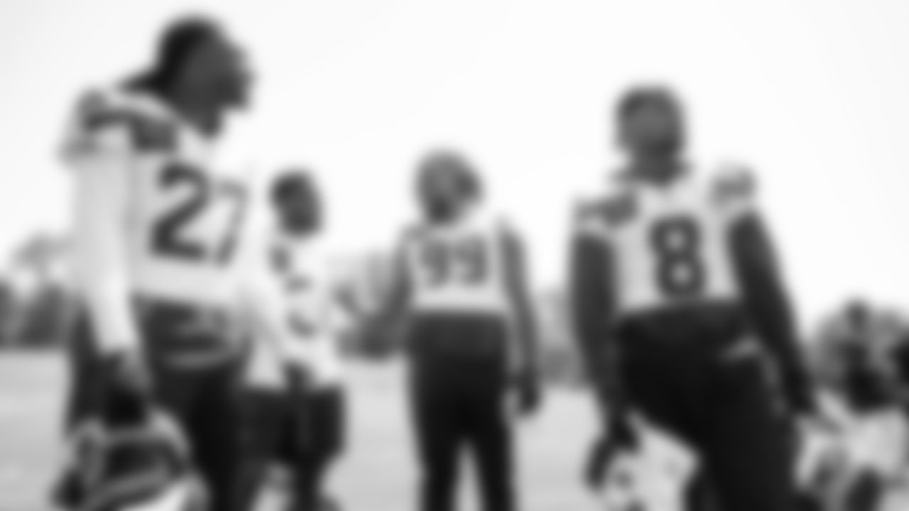 Seahawks cornerback Riq Woolen (27), cornerback Devon Witherspoon (21), defensive end Leonard Williams (99) and safety Coby Bryant (8) participated in a workout on day four of OTAs on Monday, June 2, 2025 at the Virginia Mason Athletic Center.