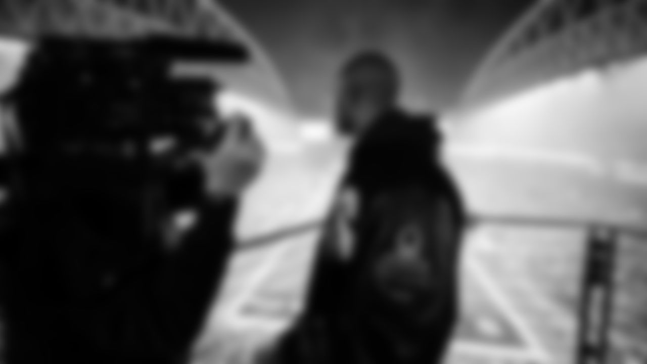 Seahawks Legend Doug Baldwin raising the flag in the 2025 Divisional Round on January 17, 2025.