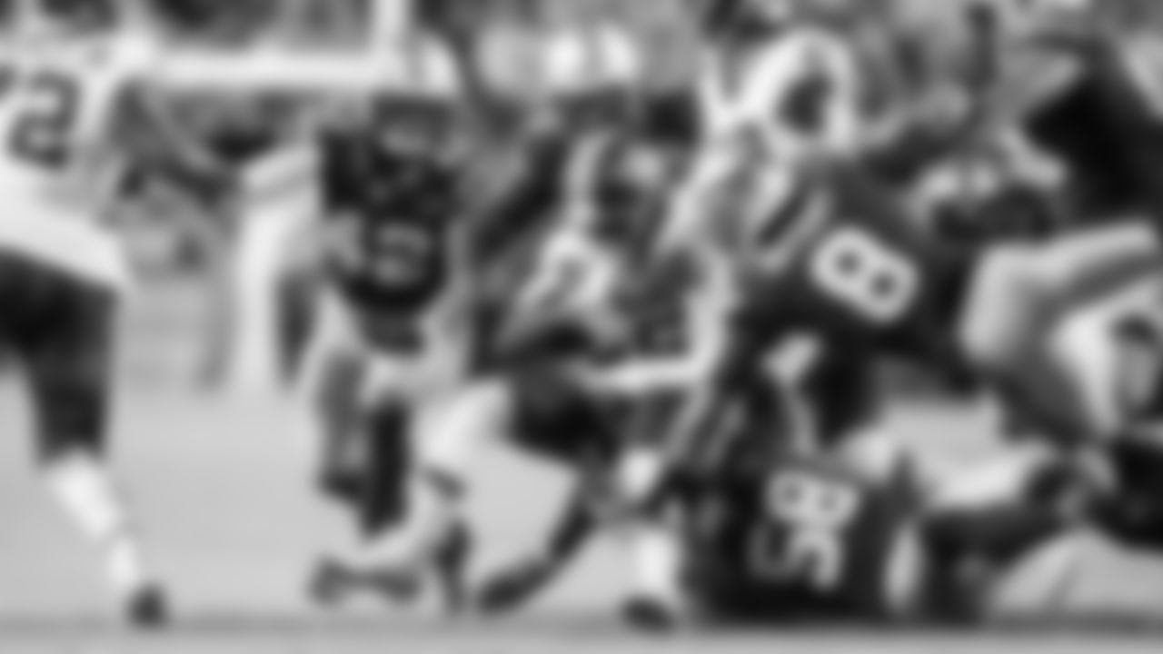 Seahawks defenders Drake Thomas, Ernest Jones IV, Coby Bryant and Derick Hall fly to the ball to make a tackle.