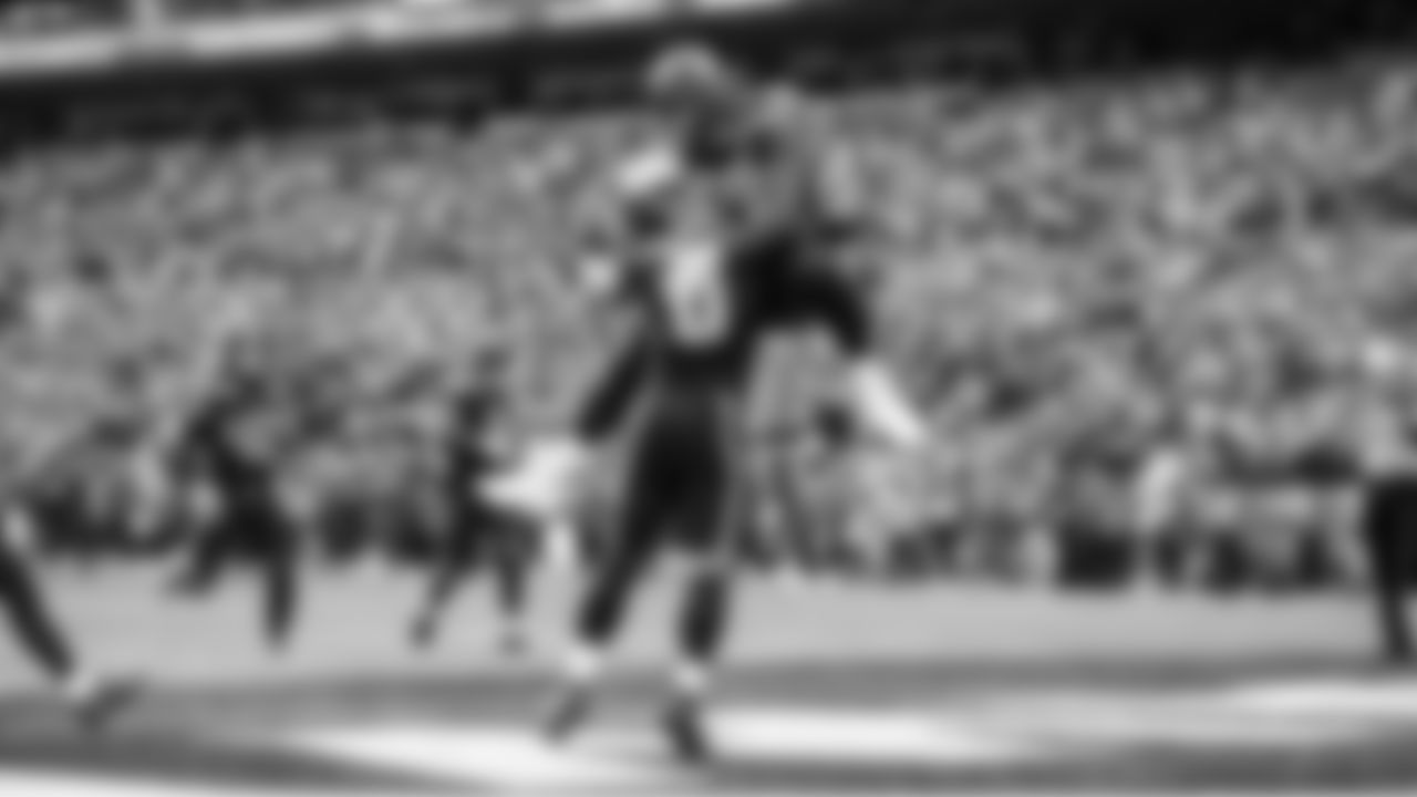 Seattle's Leonard Williams celebrates with DeMarcus Lawrence after Lawrence's second scoop-and-score of the game.