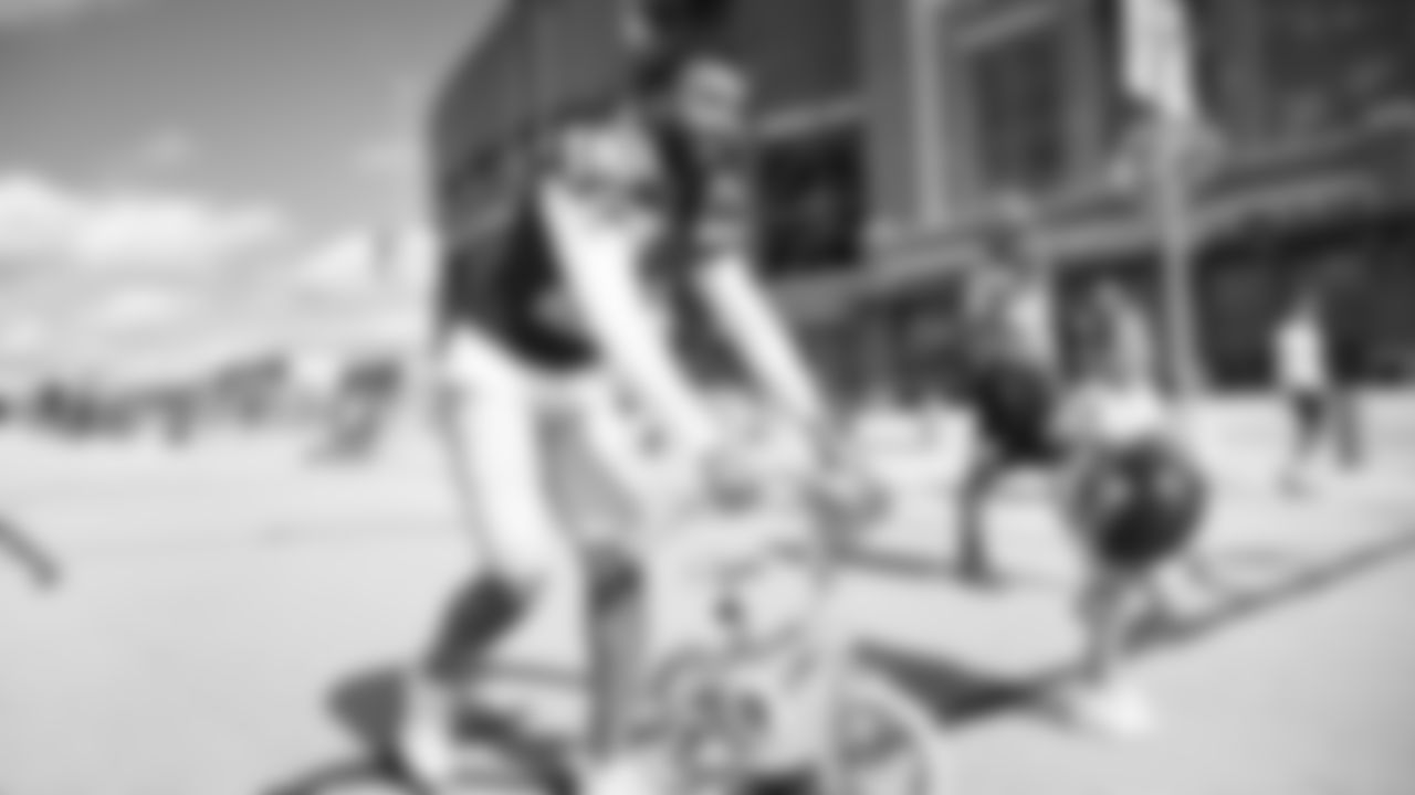 Seahawks safety Julian Love (20) rides a bike on their way to practice on August 21, 2025 in Green Bay, Wisconsin.