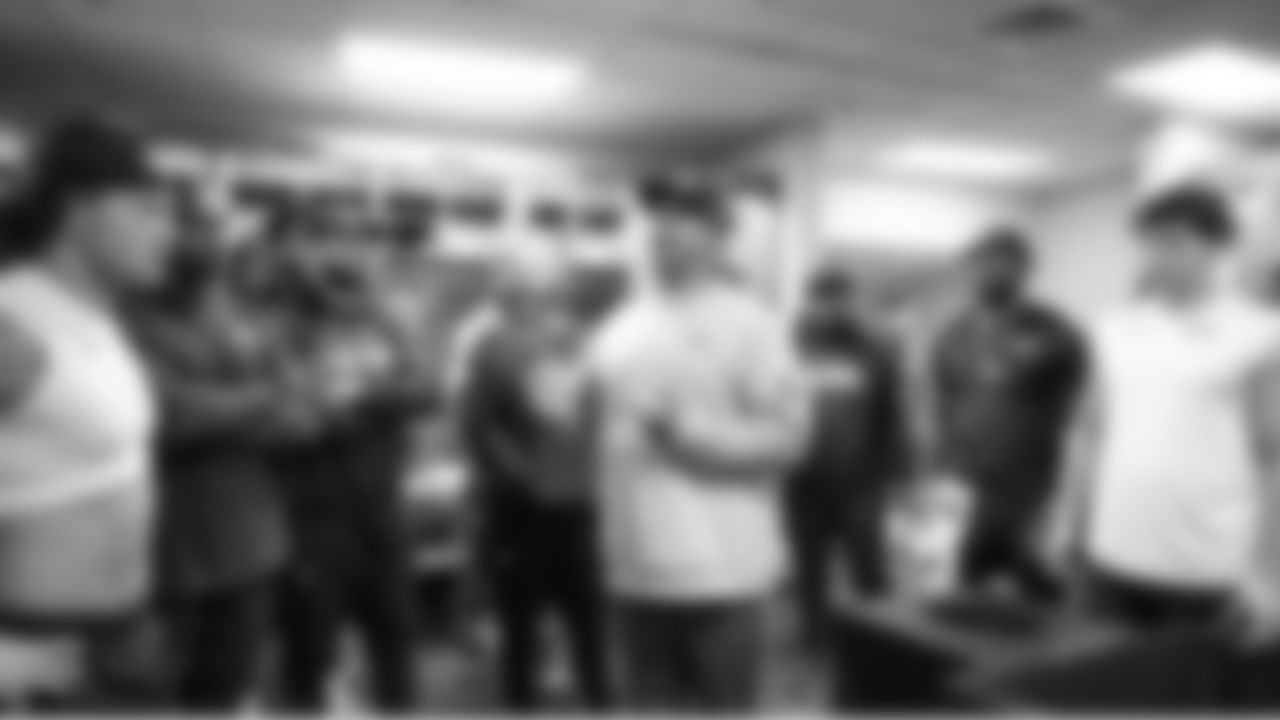 Defensive coordinator Aden Durde talks to the defense in the locker room.