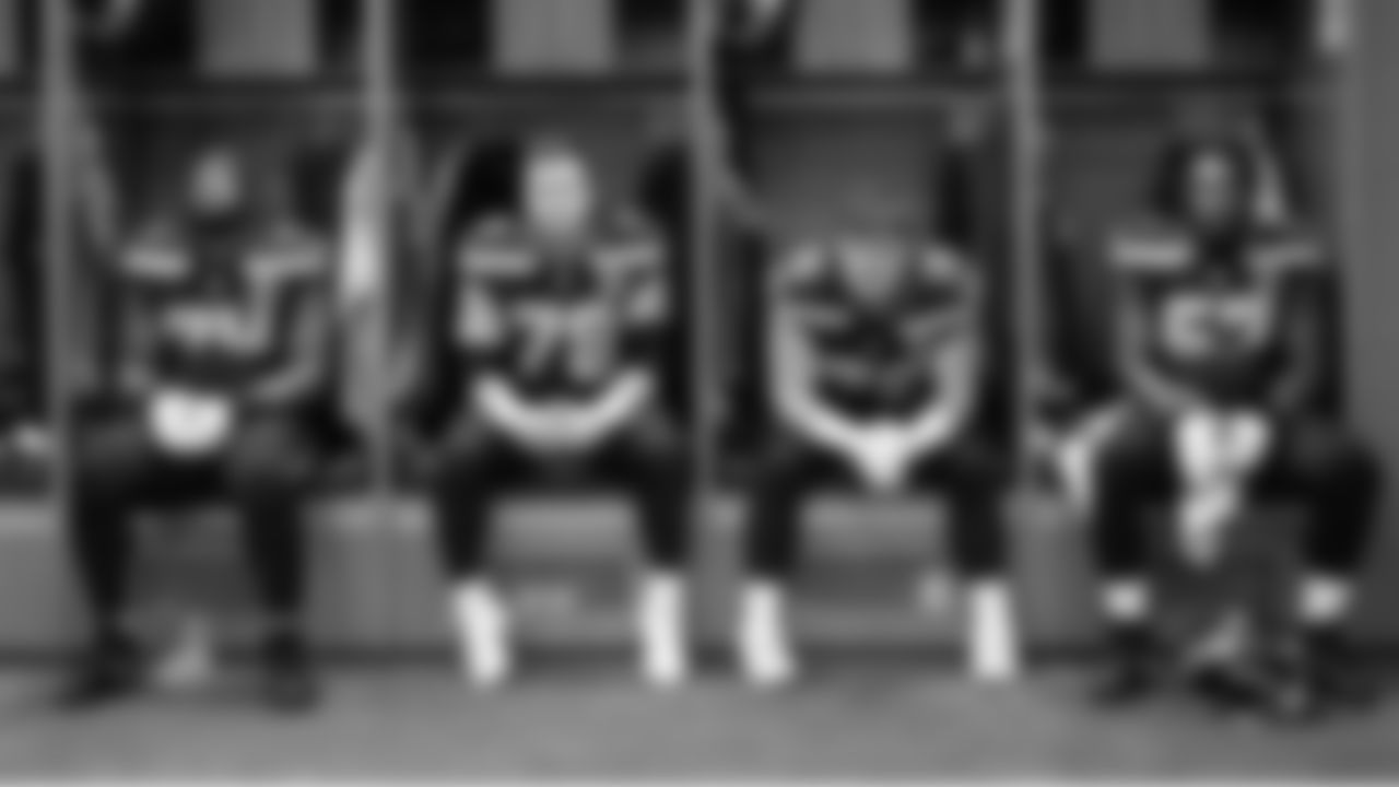Offensive linemen Josh Jones, Mason Richman, Grey Zabel and Charles Cross wait for their cue to leave the locker room for kickoff.