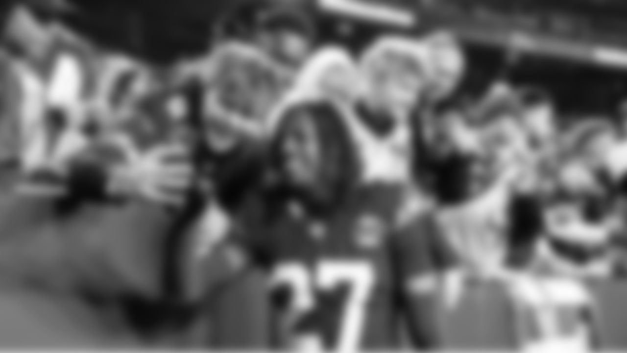 On his way to the locker room, Seahawks cornerback Riq Woolen pauses to take a selfie with a fan.