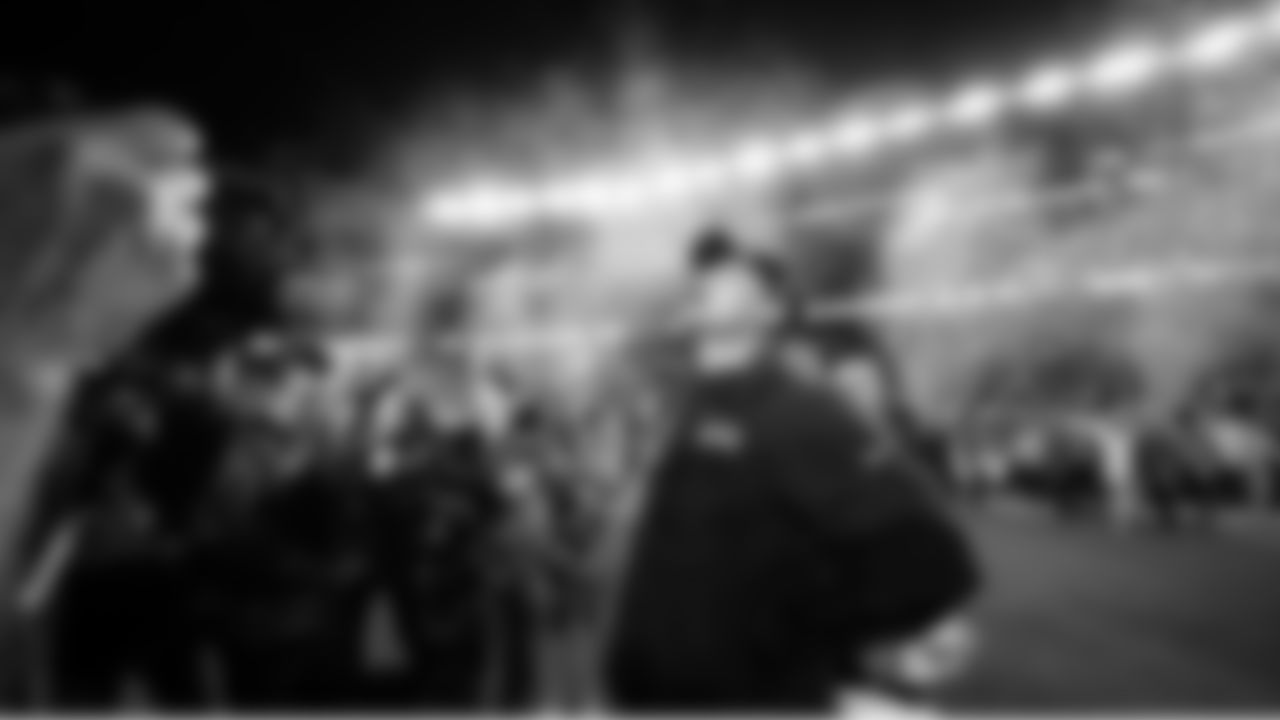 Mike Macdonald looks skyward as confetti flies after the Super Bowl victory.