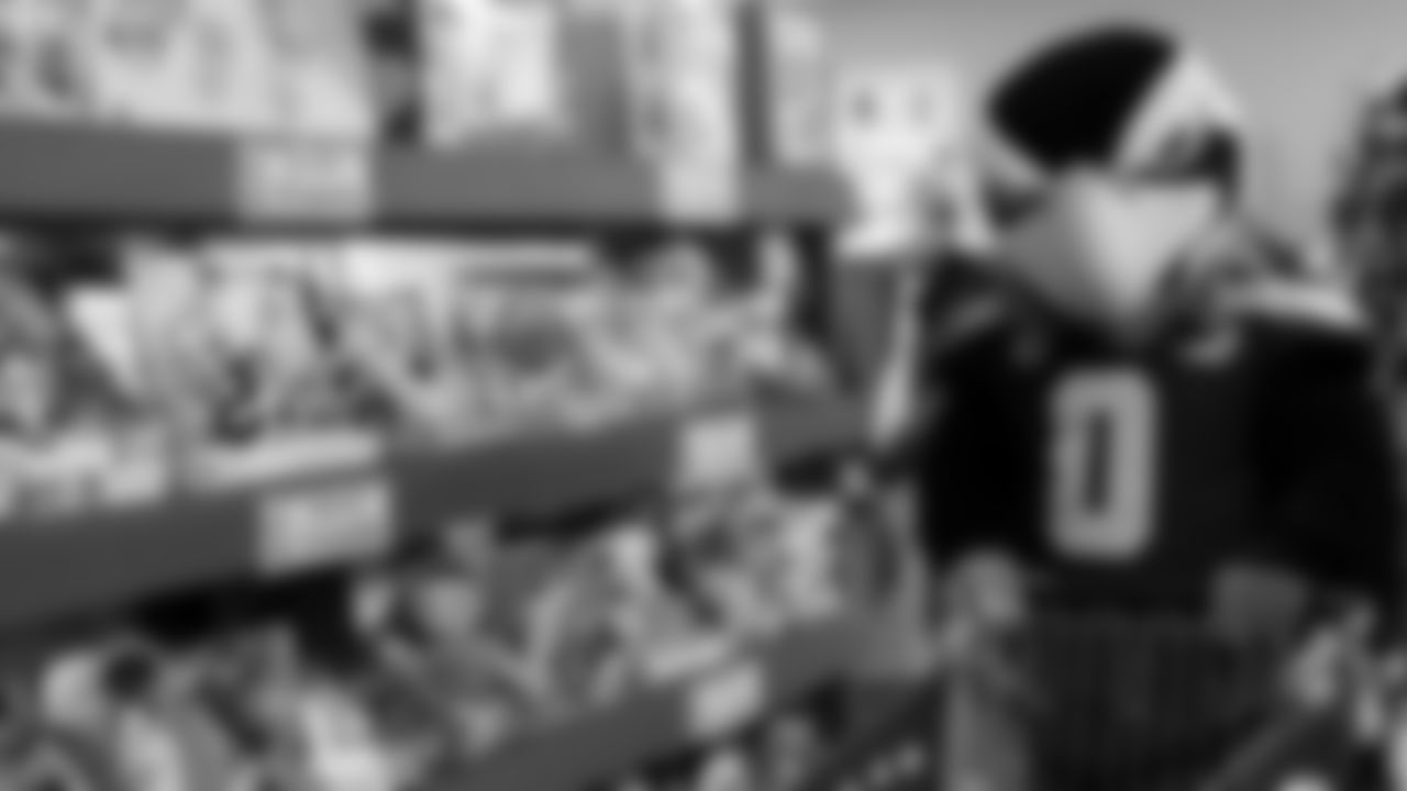 Seahawks Fullback Brady Russell, the Seahawks Dancers, and Blitz spent the day volunteering at Santa's Castle on Joint Base Lewis-McChord to celebrate the holidays and support service members and their families.