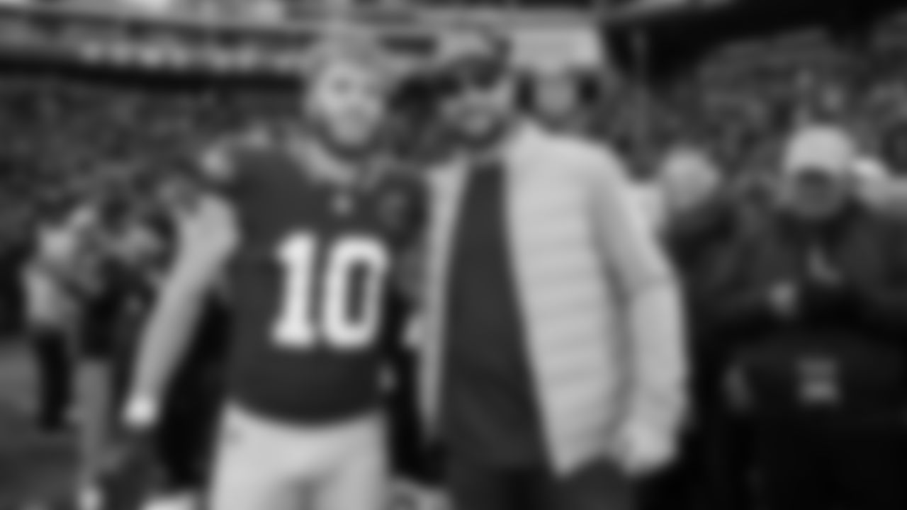 Seahawks receiver Cooper Kupp and Seattle Mariners superstar Cal Raleigh meet on the sidelines before the game.