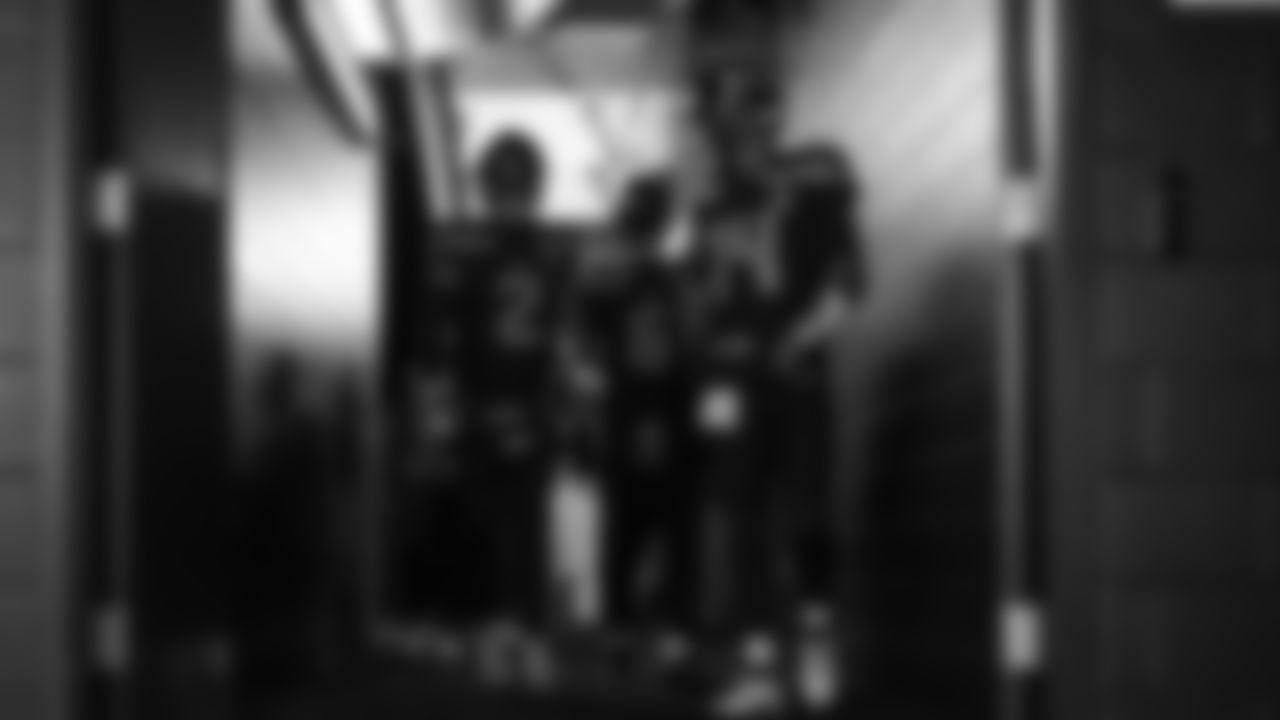 Seahawks quarterback Sam Darnold (14) walks through the Emerald Queen Casino tunnel club at Lumen Field for the Week 10 matchup vs. the Cardinals.