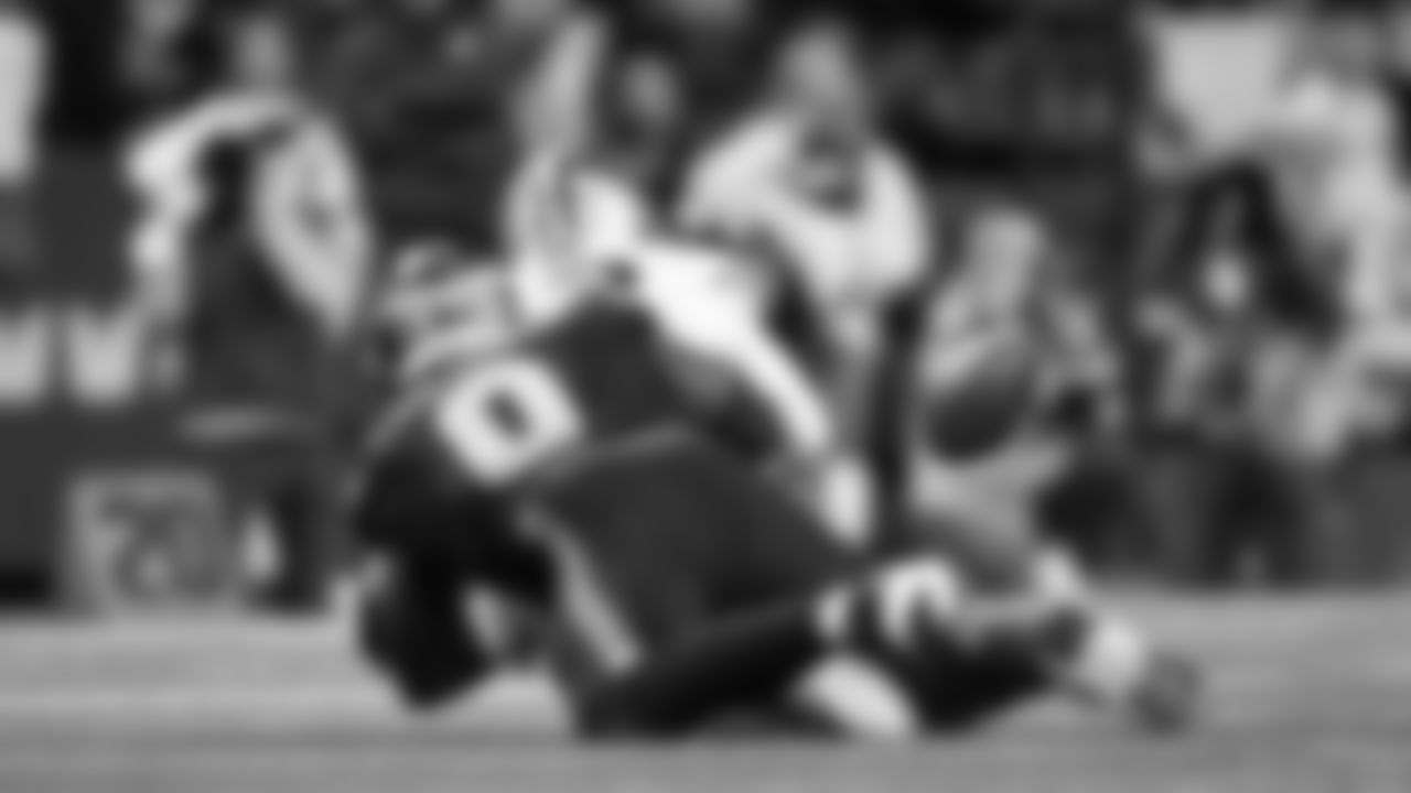 Seattle's DeMarcus Lawrence forces a fumble by 49ers quarterback Brock Purdy in the third quarter.