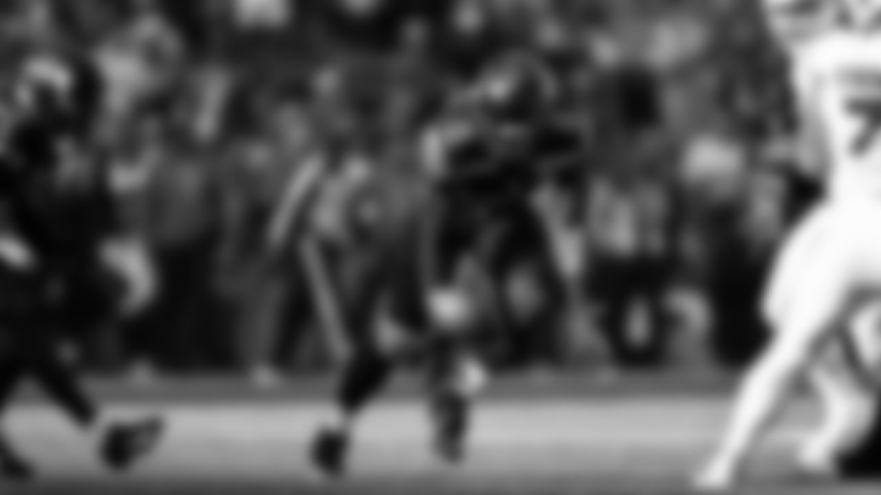 Seahawks linebacker Tyrice Knight (48) sacks Cardinals QB Jacoby Brissett and defensive end DeMarcus Lawrence (0) scoops the ball up and scores the touchdown.