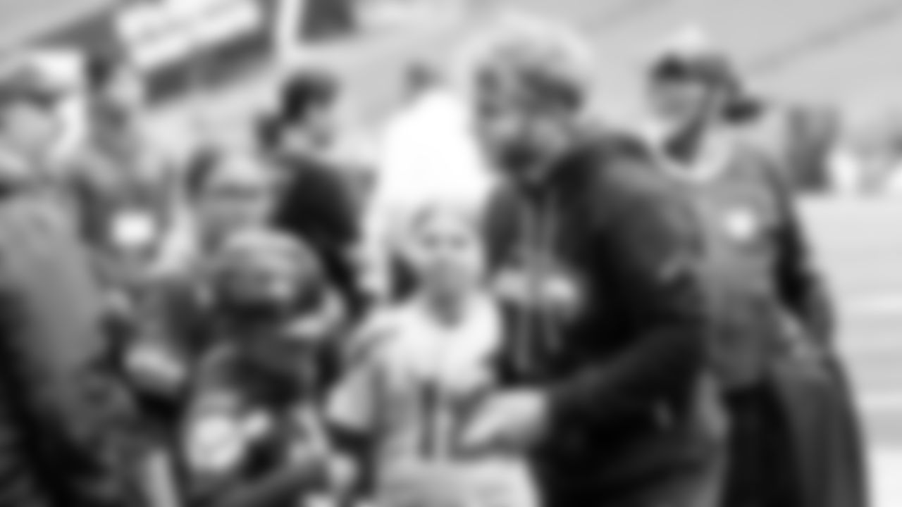 Seahawks wide receiver Cooper Kupp pauses to greet 12s during pregame.
