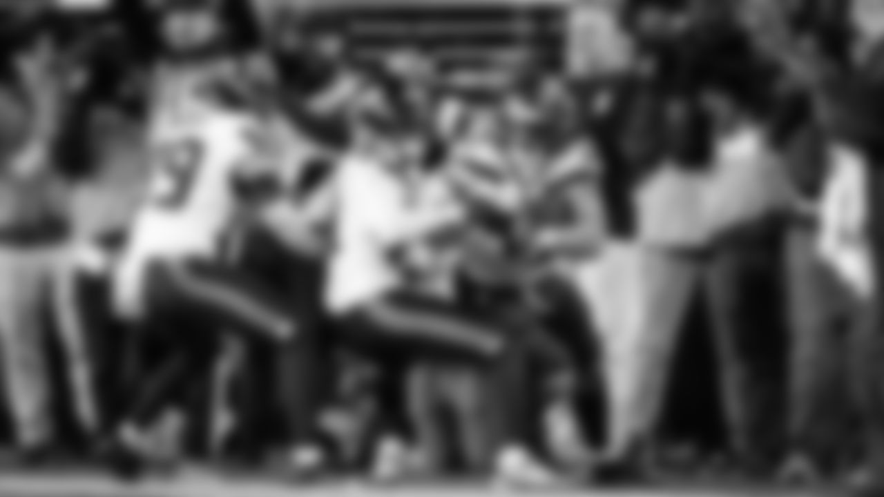 Seahawks linebacker Drake Thomas cradles the football after his key interception in the fourth quarter.