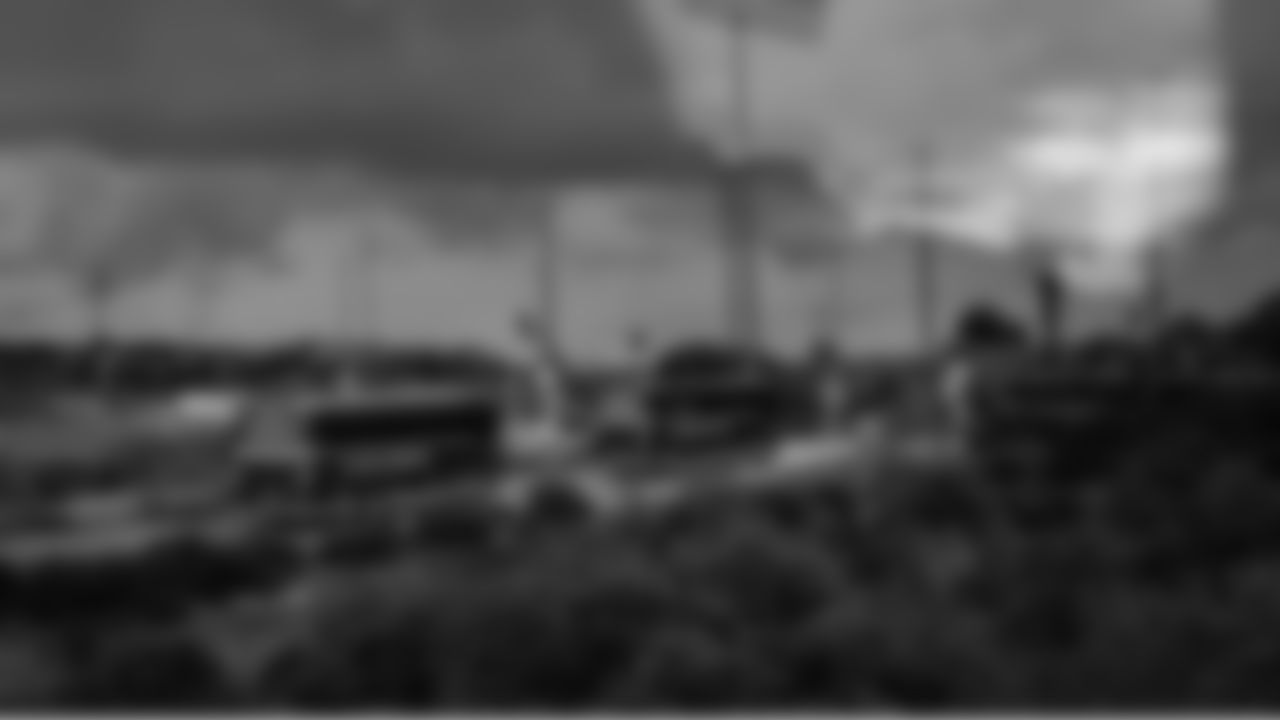 The Seahawks convoy of buses makes its way from the airport to the team hotel amid dark skies and heavy rains.