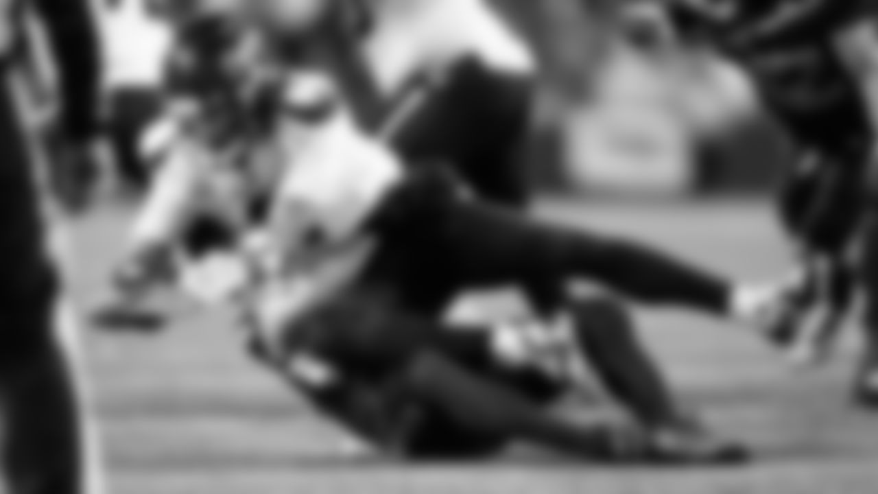 Seahawks safety Ty Okada sacks Texans quarterback C.J. Stroud.