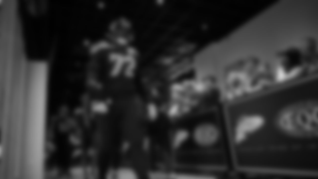 Seahawks tackle Abraham Lucas (72) walks through the Emerald Queen Casino tunnel club at Lumen Field for the Week 7 matchup vs. the Houston Texans.