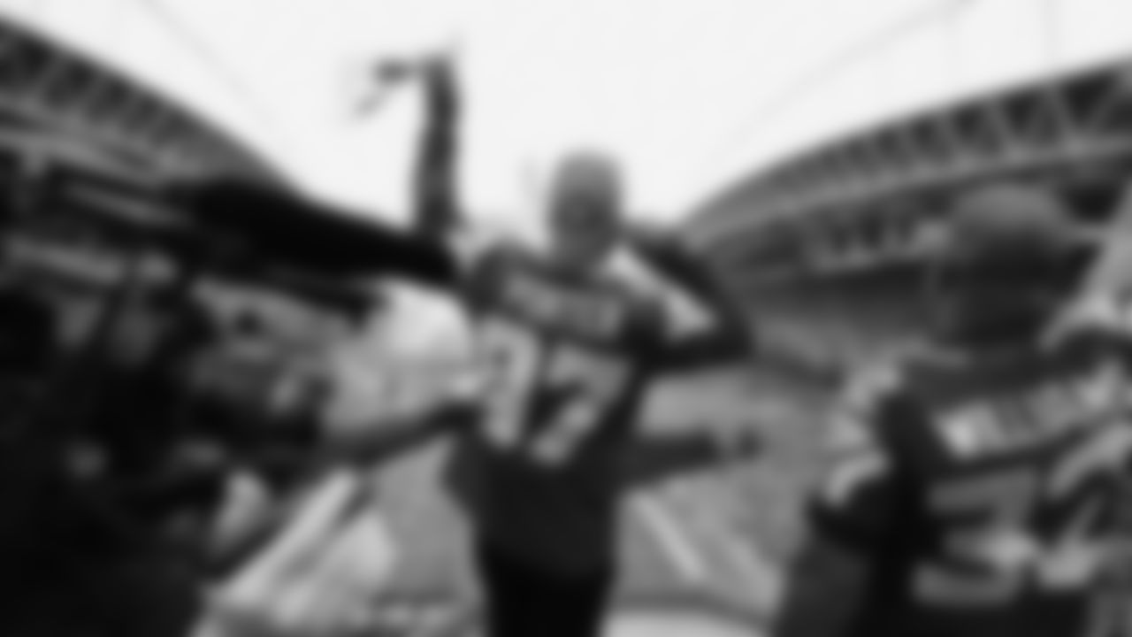 Seahawks Legends Rufus Porter and John L. Williams raise 12 flag in week 15 on December 14, 2025