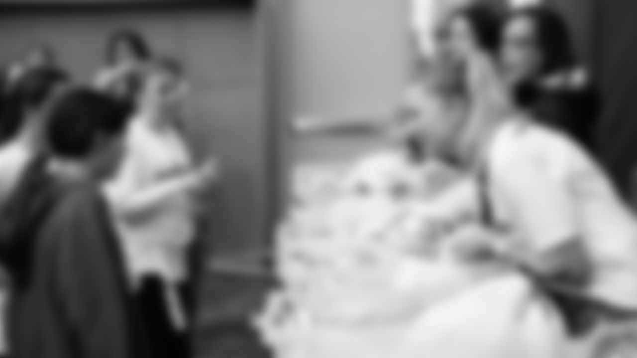 The Seahawks Women's Association packed girls flag kits and hosted a free girls flag football camp at the Seahawks training facility on Saturday, November 8, 2025.