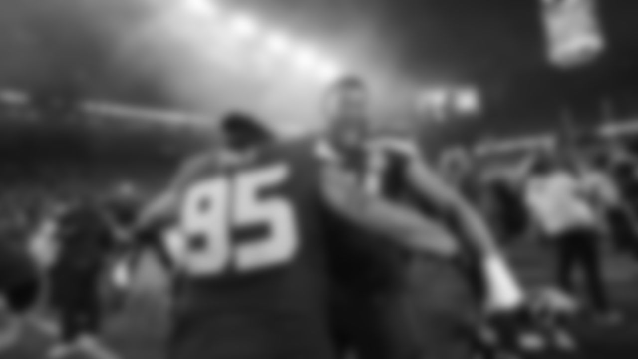 Seattle Seahawks nose tackle Brandon Pili (95) and defensive end Mike Morris celebrate after the NFC Championship NFL football game against the Los Angeles Rams, Sunday, Jan. 25, 2026, in Seattle. (AP Photo/Lindsey Wasson)