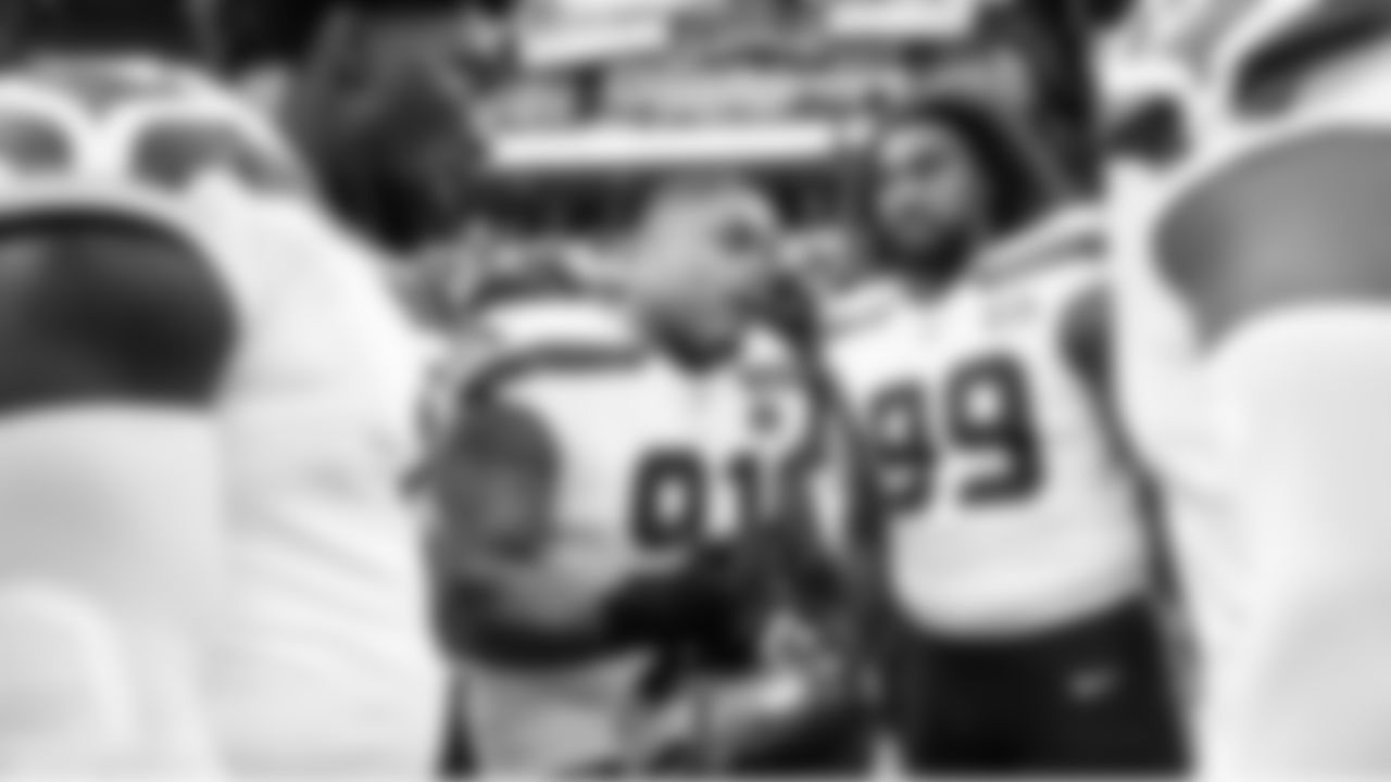 Seahawks defensive lineman Byron Murphy II talks to his teammates during pregame warmups.