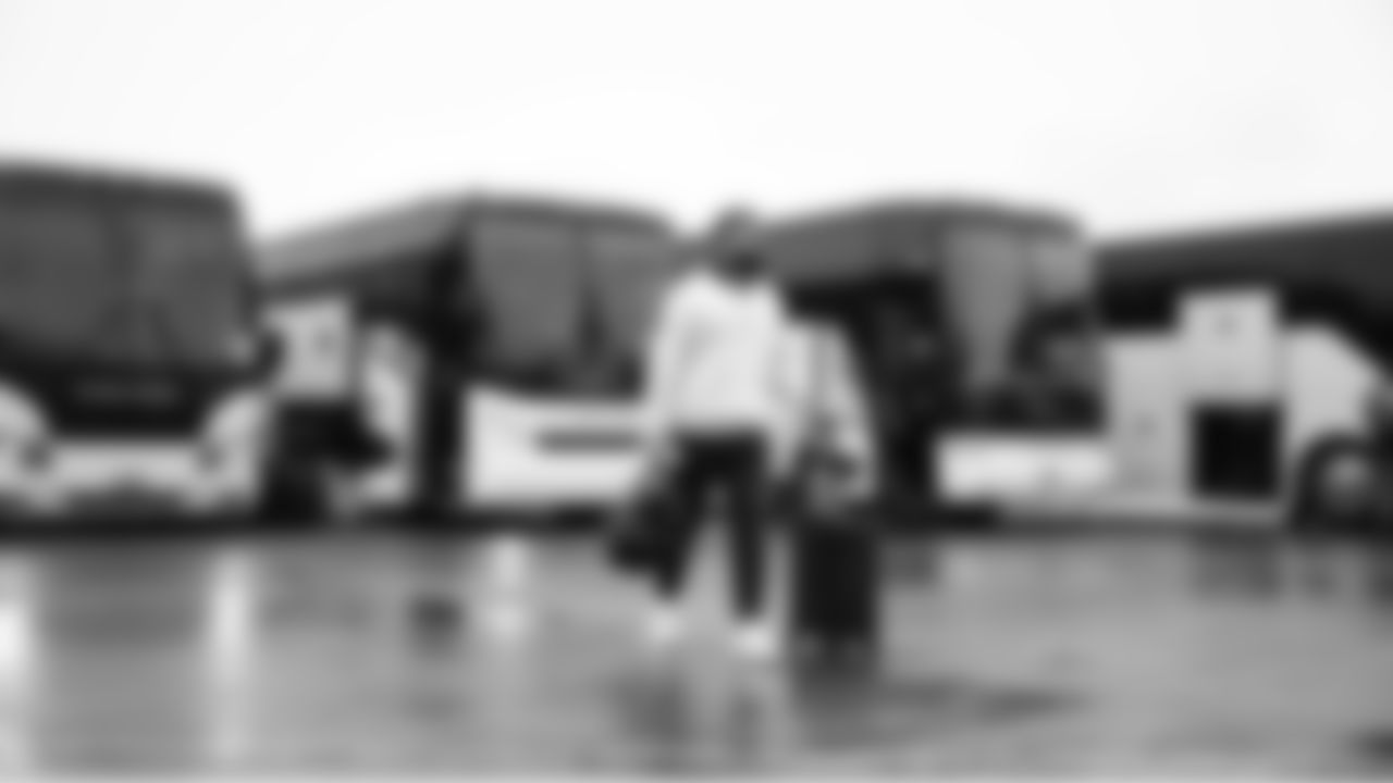 Seahawks safety Julian Love walks from the team buses to the charter flight for the trip to the Bay Area.