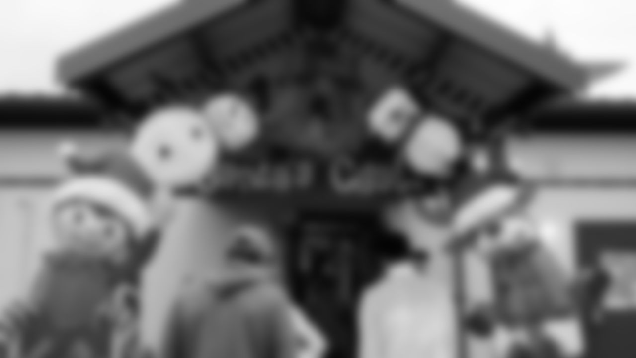 Seahawks Fullback Brady Russell, the Seahawks Dancers, and Blitz spent the day volunteering at Santa's Castle on Joint Base Lewis-McChord to celebrate the holidays and support service members and their families.