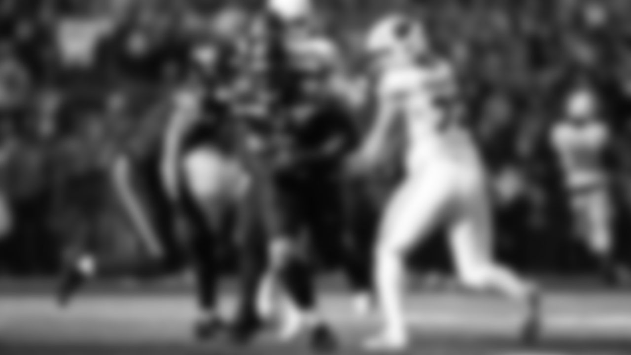 Seahawks linebacker Tyrice Knight (48) sacks Cardinals QB Jacoby Brissett and defensive end DeMarcus Lawrence (0) scoops the ball up and scores the touchdown.