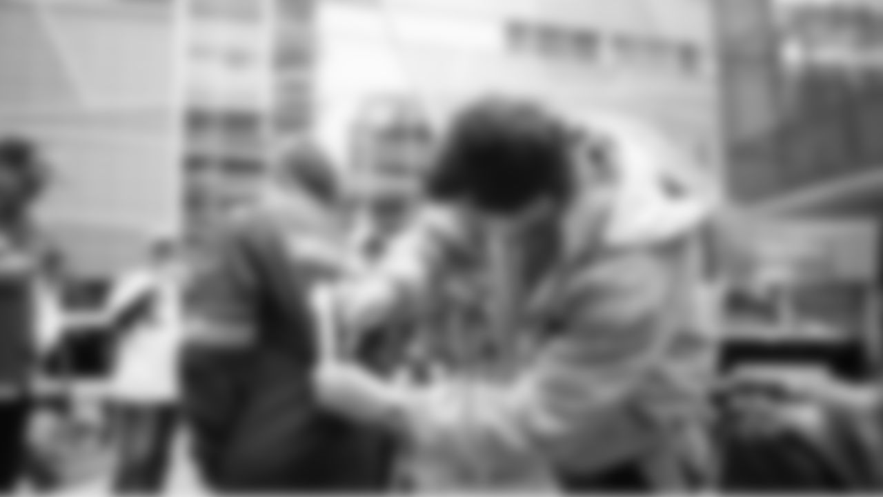 On game day, Seahawks punter Michael Dickson paused on his way to the team buses to sign an autograph for a fan.