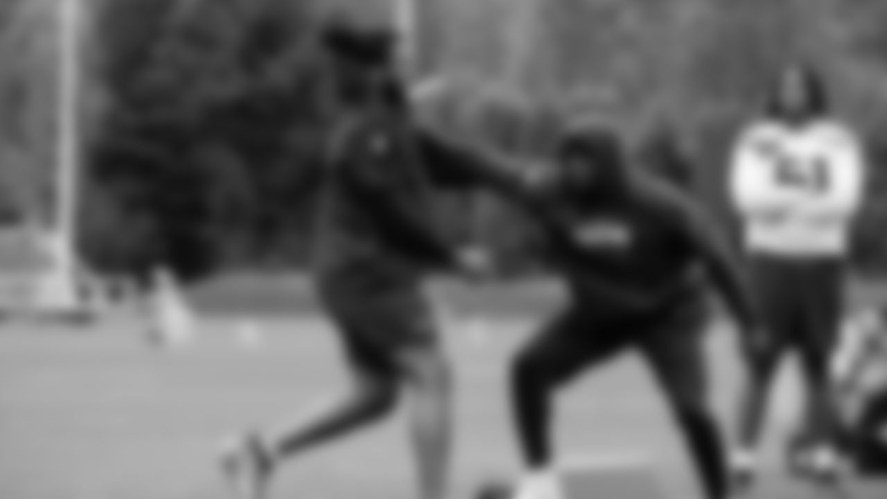 Seahawks linebacker Boye Mafe (53) and defensive end Mike Morris (94) participated in a workout on May 14, 2025 at the Virginia Mason Athletic Center.