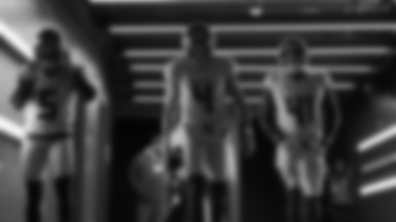 Seahawks kicker Jason Myers (5), punter Michael Dickson (4) and long snapper Chris Stoll (41) walk through the Emerald Queen Casino tunnel club at Lumen Field for the Week 16 matchup vs. Rams.