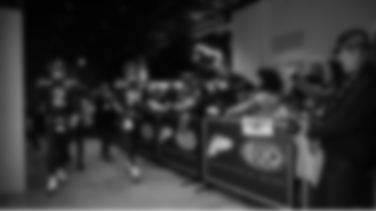 Seahawks quarterback Sam Darnold (14) walks through the Emerald Queen Casino tunnel club at Lumen Field for the Week 15 matchup vs. the Colts.