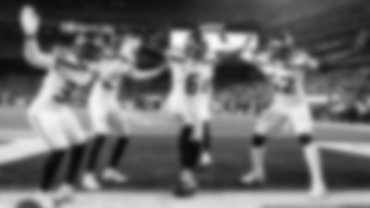 Seattle's Quandre Diggs celebrates his interception with teammaates Jerrick Reed II, Devon Witherspoon and Darrell Taylor.