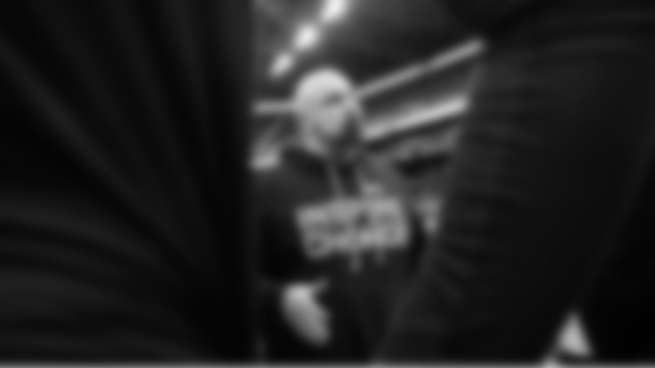 Outside linebackers coach Chris Partridge talks to his players.