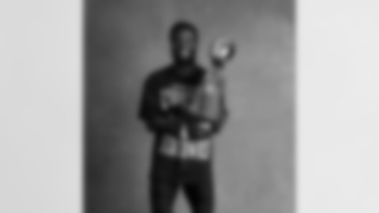 Seahawks cornerback Devon Witherspoon (21) with the Lombardi Trophy after winning Super Bowl LX.