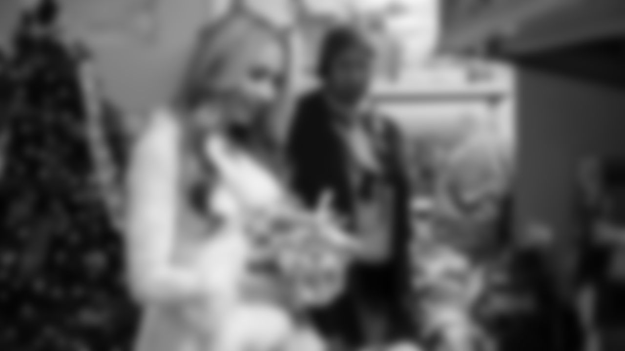 Seahawks Fullback Brady Russell, the Seahawks Dancers, and Blitz spent the day volunteering at Santa's Castle on Joint Base Lewis-McChord to celebrate the holidays and support service members and their families.