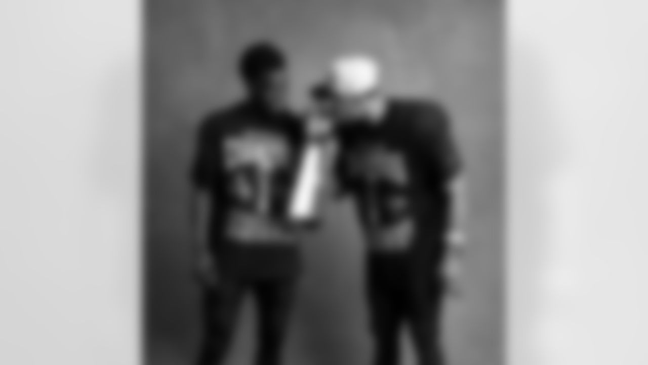 Seahawks cornerback Devon Witherspoon (21) and wide receiver Jaxon Smith-Njigba (11) with the Lombardi Trophy after winning Super Bowl LX.