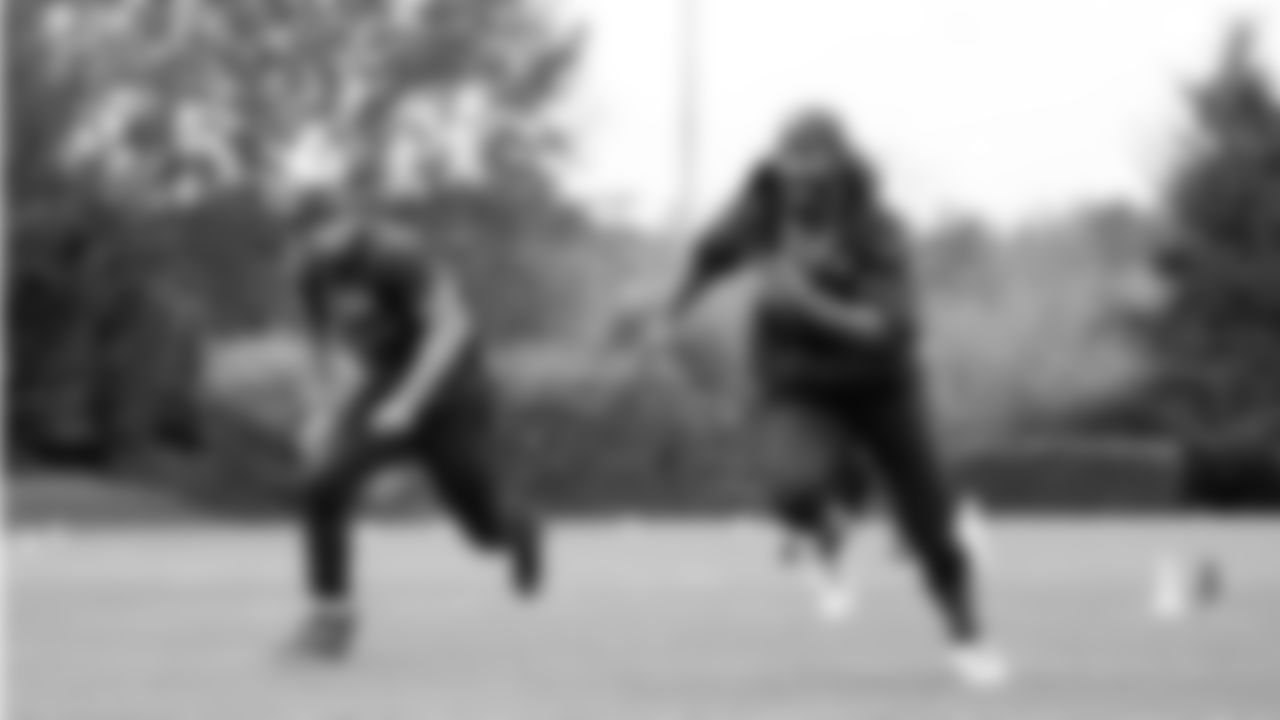 Seahawks running back Kenny McIntosh (25) and running back Zach Charbonnet (26) participated in a workout on May 21, 2025 at the Virginia Mason Athletic Center.