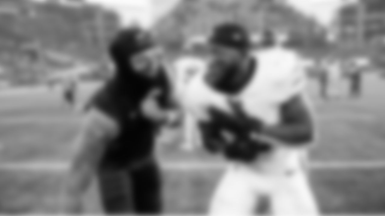 After the game, Seahawks receiver Jaxon Smith-Njigba and Cardinals safety Budda Baker re-enact and share a laugh over a hit earlier in the game.