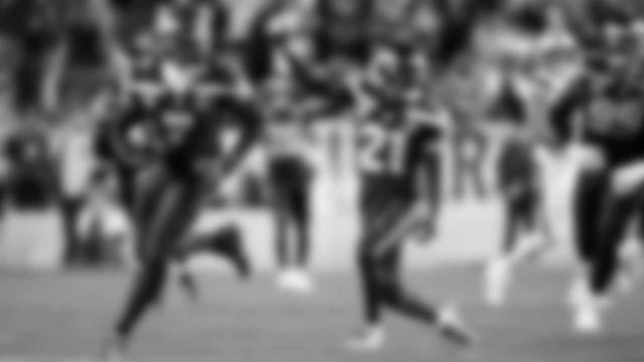 Devon Witherspoon celebrates his hit that resulted in teammate Uchenna Nwosu's interception in the fourth quarter.