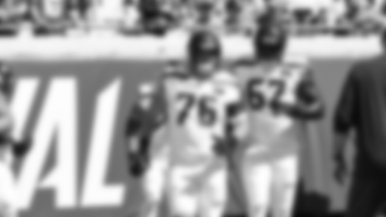 Seahawks guard Grey Zabel (76) and tackle Charles Cross (67) warm up at EverBank Stadium on October 12, 2025.