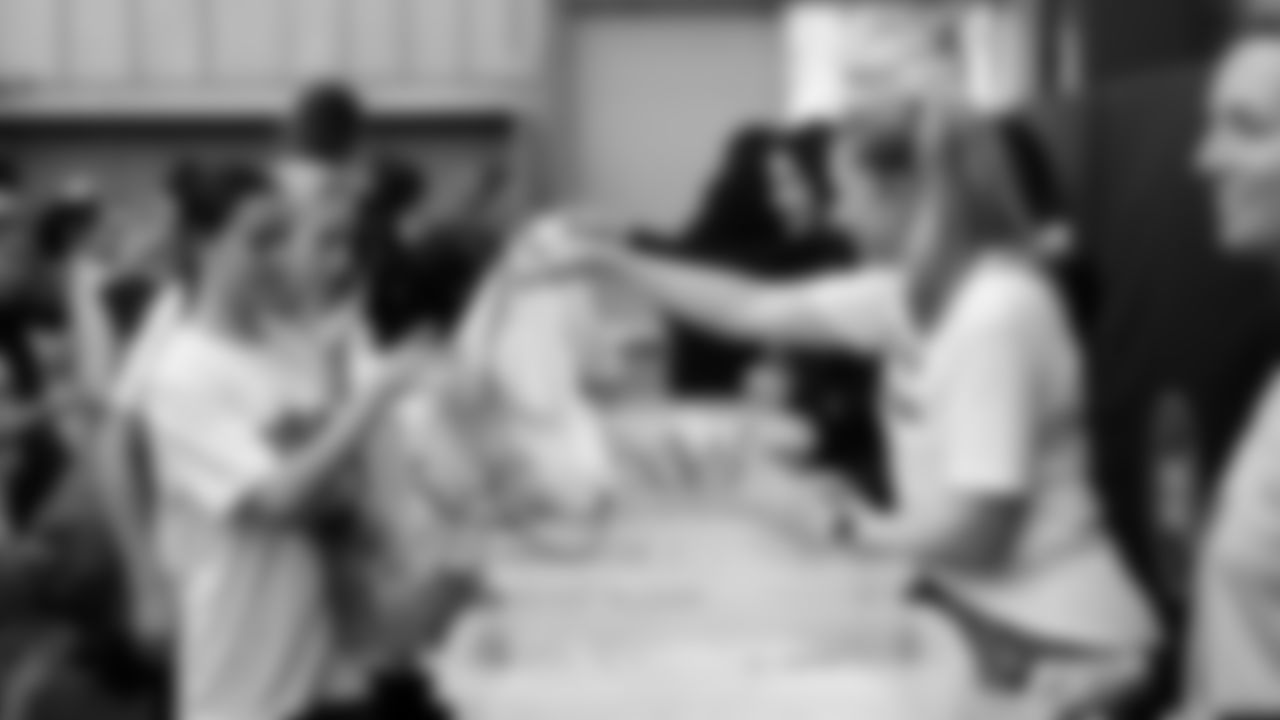 The Seahawks Women's Association packed girls flag kits and hosted a free girls flag football camp at the Seahawks training facility on Saturday, November 8, 2025.