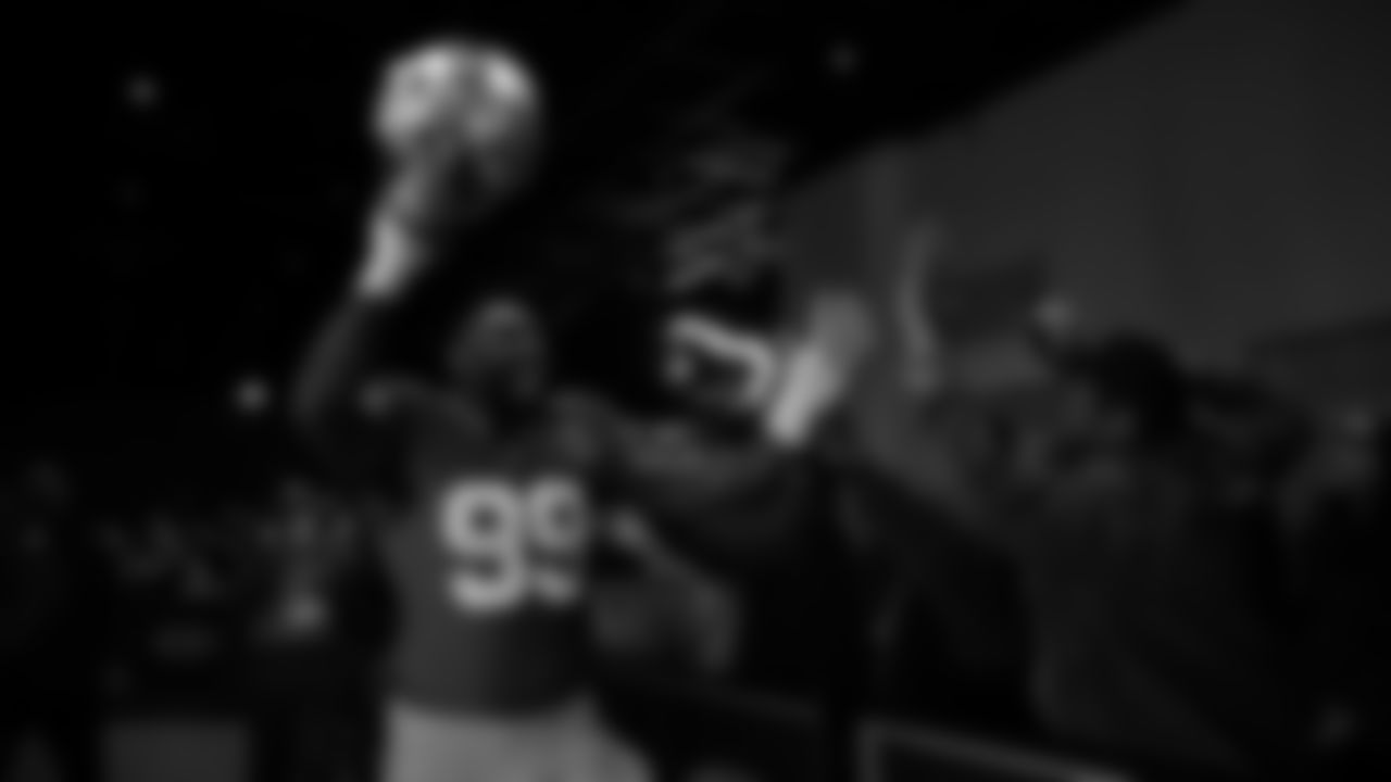 Seahawks defensive end Leonard Williams (99) walks through the Emerald Queen Casino tunnel club at Lumen Field for the Week 13 matchup vs. the Vikings.