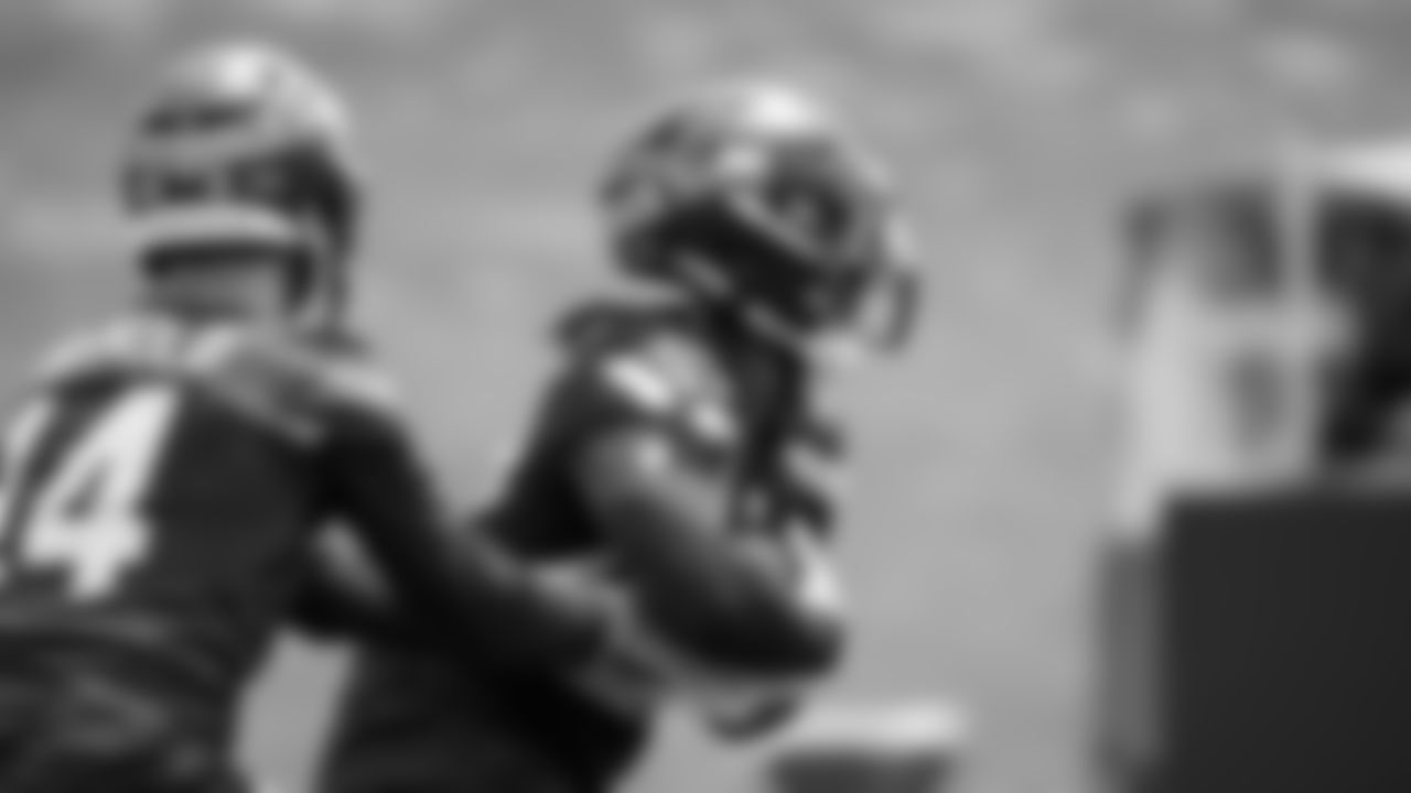 Seahawks quarterback Sam Darnold (14) and running back Damien Martinez (22) participated in a workout on day five of OTAs on Wednesday, June 4, 2025 at the Virginia Mason Athletic Center.