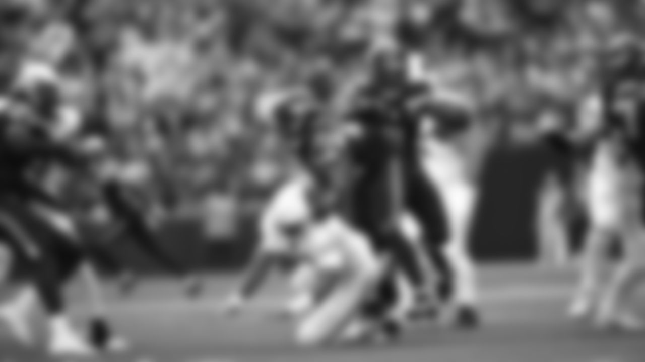 Seahawks linebacker Tyrice Knight (48) sacks Cardinals QB Jacoby Brissett and defensive end DeMarcus Lawrence (0) scoops the ball up and scores the touchdown.