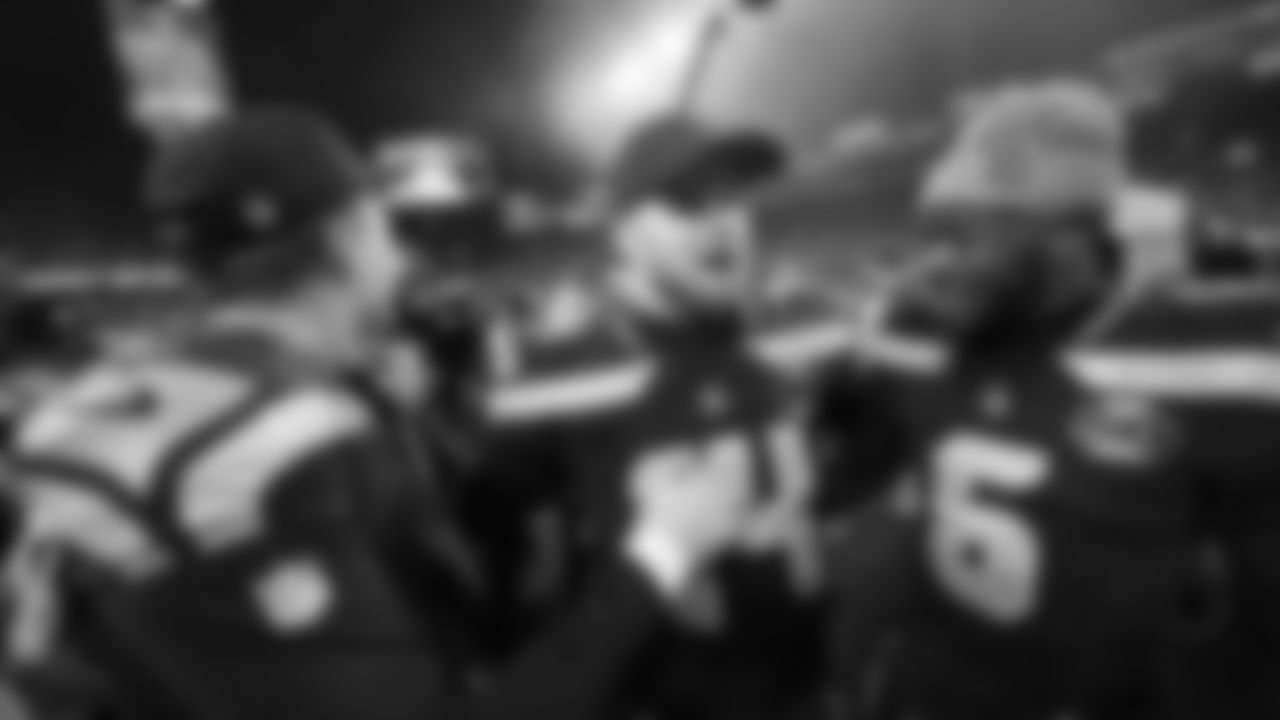 Seattle Seahawks quarterback Sam Darnold, center, celebrates with quarterback Jalen Milroe (6) quarterback Drew Lock, left, after the NFC Championship NFL football game Sunday, Jan. 25, 2026, in Seattle. (AP Photo/Lindsey Wasson)