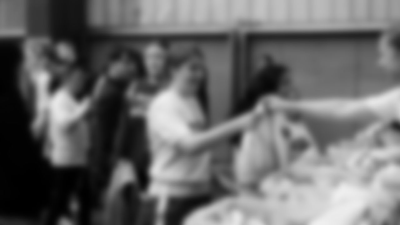 The Seahawks Women's Association packed girls flag kits and hosted a free girls flag football camp at the Seahawks training facility on Saturday, November 8, 2025.