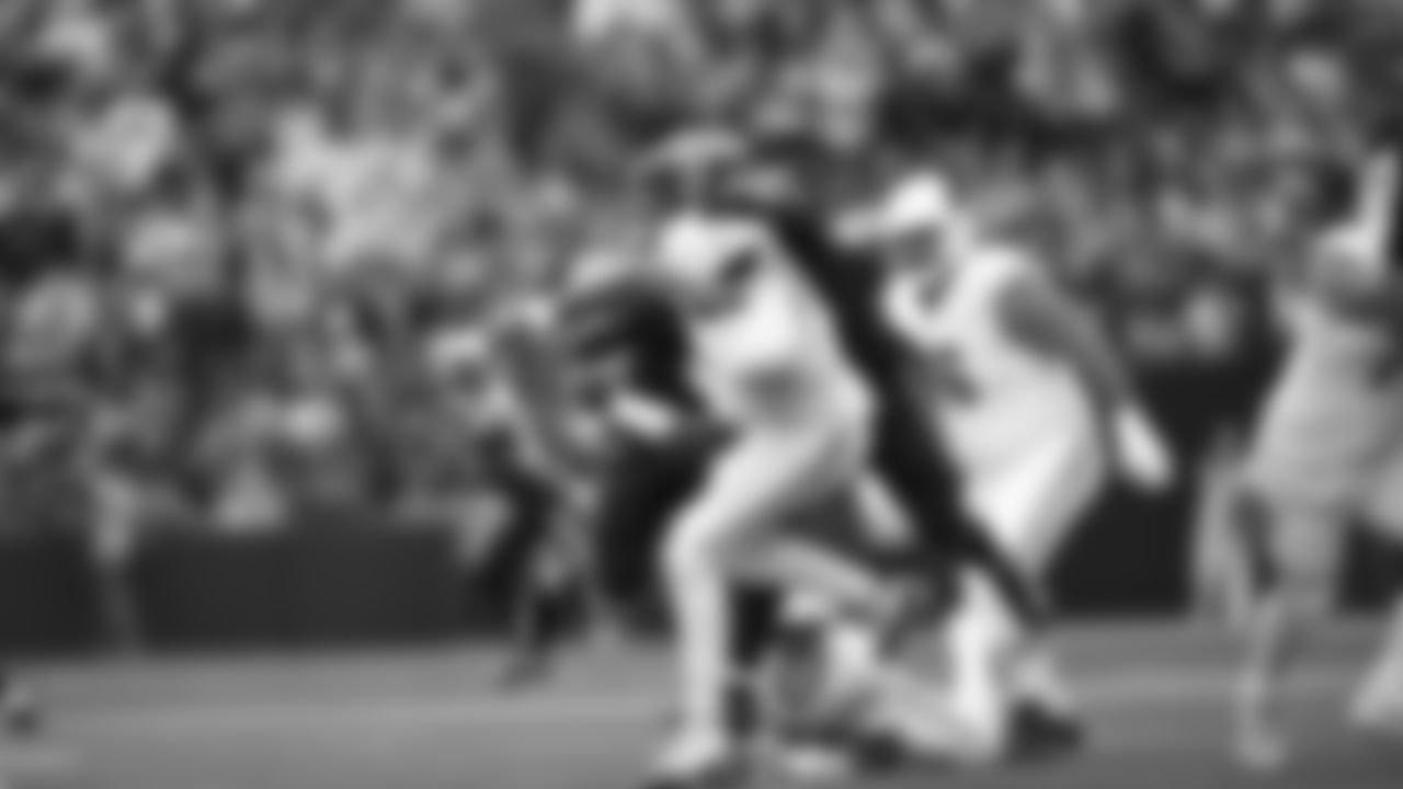 Seahawks linebacker Tyrice Knight (48) sacks Cardinals QB Jacoby Brissett and defensive end DeMarcus Lawrence (0) scoops the ball up and scores the touchdown.